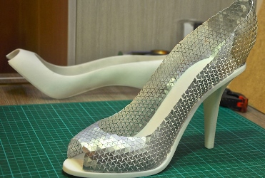 Researchers used a computational design tool to make a shoe whose base was 3D printed while the upper part was made from auxetic material. Image credit: CMU.
