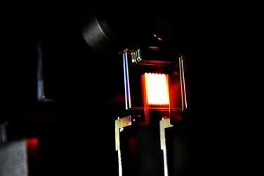 A proof-of-concept built by MIT researchers achieves efficiency comparable to some fluorescent and LED bulbs. Image credit: MIT.