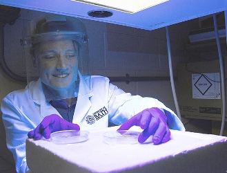 Dr. Olivier Reelfs, from the University of Bath's Department of Pharmacy and Pharmacology, carries out tests with an ultraviolet lamp. Image credit: AP Commercial Photography