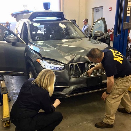 Investigators examine the crash vehicle. Source: NTSB