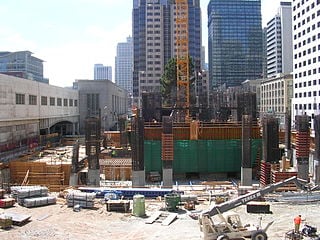 Crane footing, concrete core and construction equipment in August 2006.