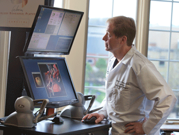 Figure 4: The Cerebral Surgery Rehearsal Platform (SRP) shows Dr. Warren Selman working with a Geometric Touch at the Case University Hospital of Cleveland. Credit: University of Cleveland.