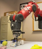 A robot learns about its world by poking  and pushing objects.
