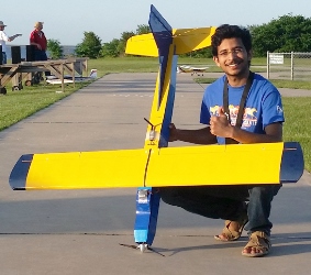 Sampath Vengate with a UAV that uses weights in the wings to maneuver. Image credit: University of Texas at Arlington