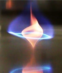The yellow color is due to radiating soot particles. Blue in the whirl indicates there is enough oxygen for complete combustion, which means less or no soot and a cleaner burn. Image credit: A. James Clark School of Engineering.