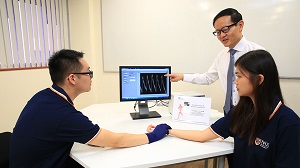 NUS researchers developed a novel microfiber sensor for real-time healthcare monitoring and diagnosis. The sensor can be woven into a glove to monitor heart rate and blood pressure. (Source: NUS)
