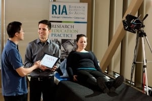 Researchers analyze blood-flow data extracted via the touchless device, pictured right. Image credit: Fred Hunsberger/University of Waterloo.