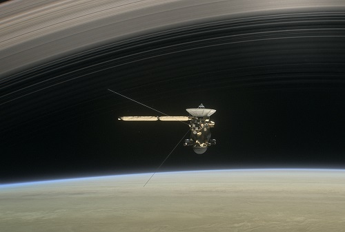 An artist rendering of Cassini making one of its final five dives through Saturn’s upper atmosphere. (Source: NASA) 