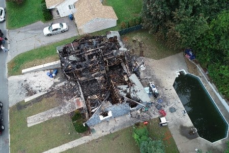 Aerial view of a home destroyed by fire after the September 13 accident. Source: NTSB