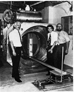 The first human MRI scanner machine, constructed in 1977. Left to right are doctors Damadian, M. Goldsmith and L. Minkoff. Image source: Fonar Corp.