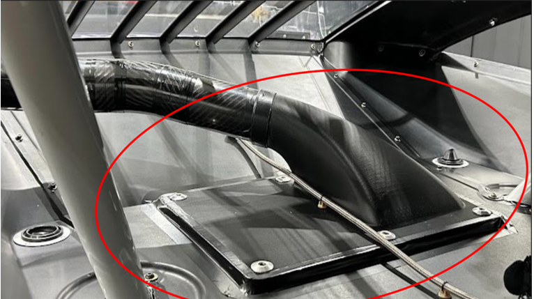 Figure 2. Gear cooler plenum circled in red. In-house printing saves approximately 97% of the cost, with a reduced lead time as well. Source: BigRep