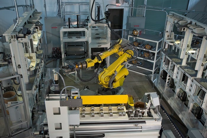 The automated system demilitarizes warheads by cutting them into separate sections, removing foam packs filled with grenades and detaching grenade fuses. Source: Regina Valenzuela