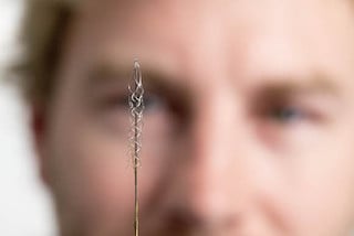 This tiny device can read signals from the brain's motor cortex. Image credit: University of Melbourne.