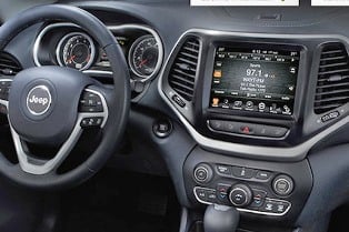   The UConnect radio head unit of a 2015 Jeep Cherokee, the same type that was hacked by two security experts. Credit: Chrysler 