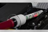 Click to enlarge. The DC Hot Stick voltage probe can accurately detect the presence of DC voltages within a hybrid electric vehicle. Credit: Carlos Jones, ORNL 