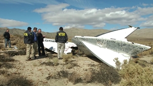 NTSB Go-Team inspects a tail section of the VSS2 spacecraft. Source: wikipedia.com 