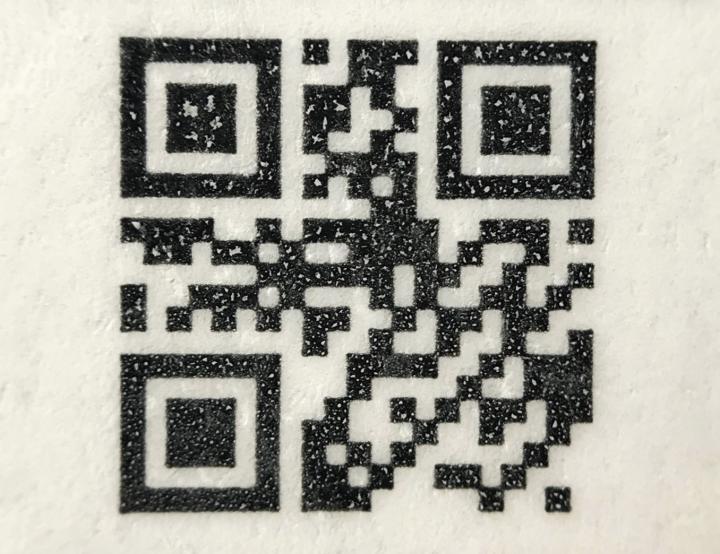 The researchers tested the system by producing tags consisting of QR-codes printed on paper and sprayed with transparent ink containing various microparticles. Source: Thomas Just Sørensen