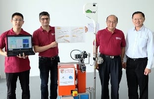 NTU Assistant Professor Erdal Kayacan (second from left), NTU Robotic Research Center Director Chen I-Ming (second from right) and JTC Technical Services Division Director Koh Chwee (right) stand with QuicaBot. Image credit: NTU