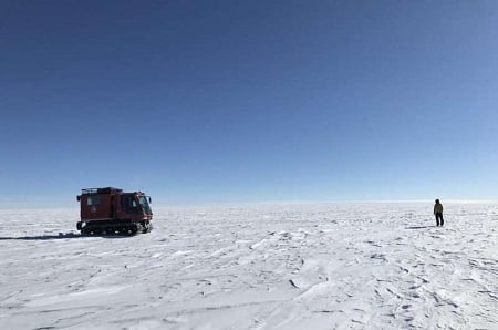 NASA researchers on the surface of the Antarctic Ice Sheet. Source: NASA Goddard Space Flight Center/Kelly Brunt