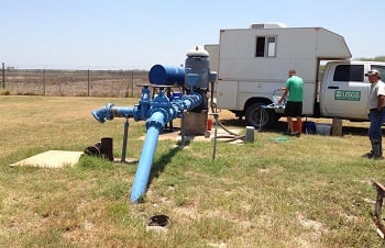 USGS scientists collecting water quality samples at a public-supply well overlying the Eagle Ford Shale production area in Texas. (Credit: Patty Ging, U.S. Geological Survey. Public domain)
