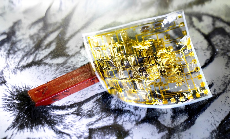 Electronic skin with fully integrated flexible electronics for robots and wearables