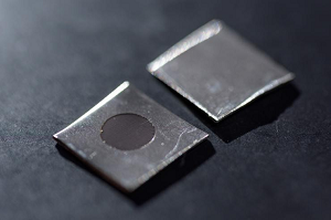 Close-up image shows an untreated stainless steel sample (left), and a sample electrochemically treated to create a nanotextured surface. Source: Rob Felt, Georgia Tech