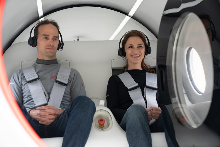 Josh Giegel and Sara Luchian, Virgin employees, prepare to ride in the hyperloop pod XP-2 in what is claimed to be the first humans to ride in the transportation system. Source: Virgin Hyperloop