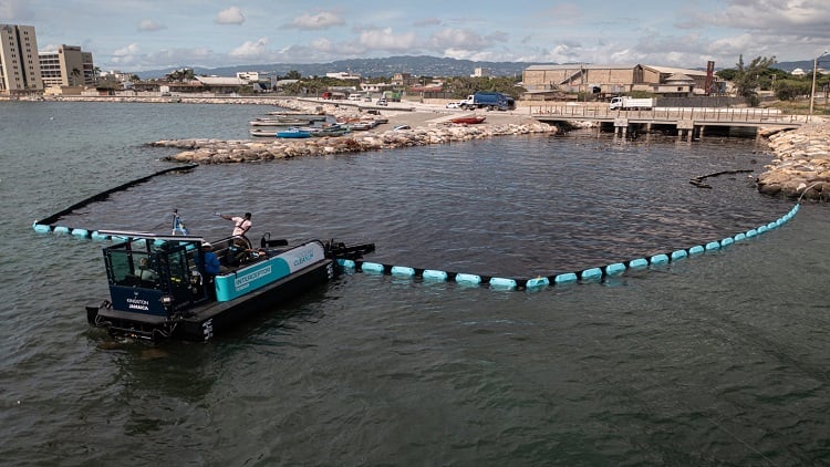 Interceptor Barrier and Interceptor Tender deployed in Kingston Harbor, Jamaica. Source: The Ocean Cleanup