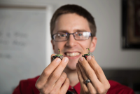 Aaron Becker, assistant professor of electrical and computer engineering at the University of Houston, is leading a project to develop millimeter-sized robots that can deliver drugs and other medical interventions noninvasively. Image credit: University of Houston