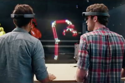 Two employees from ModBot use the HoloLens, and Autodesk 360 design software in an illustration of what it looks like to design a robot, which hangs in the air in front of them. Image source: Autodesk