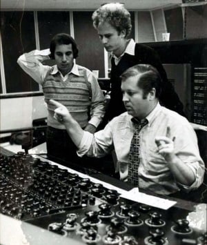 Roy Halee with Paul Simon (l) and Art Garfunkel (r) at Columbia Studios in front of a console used for 8-track recording. Image source: HistoryofRecording.com