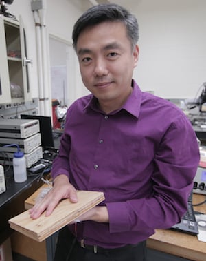 Associate Professor Xudong Wang holds a prototype of his energy-harvesting technology. Image credit Stephanie Precourt.