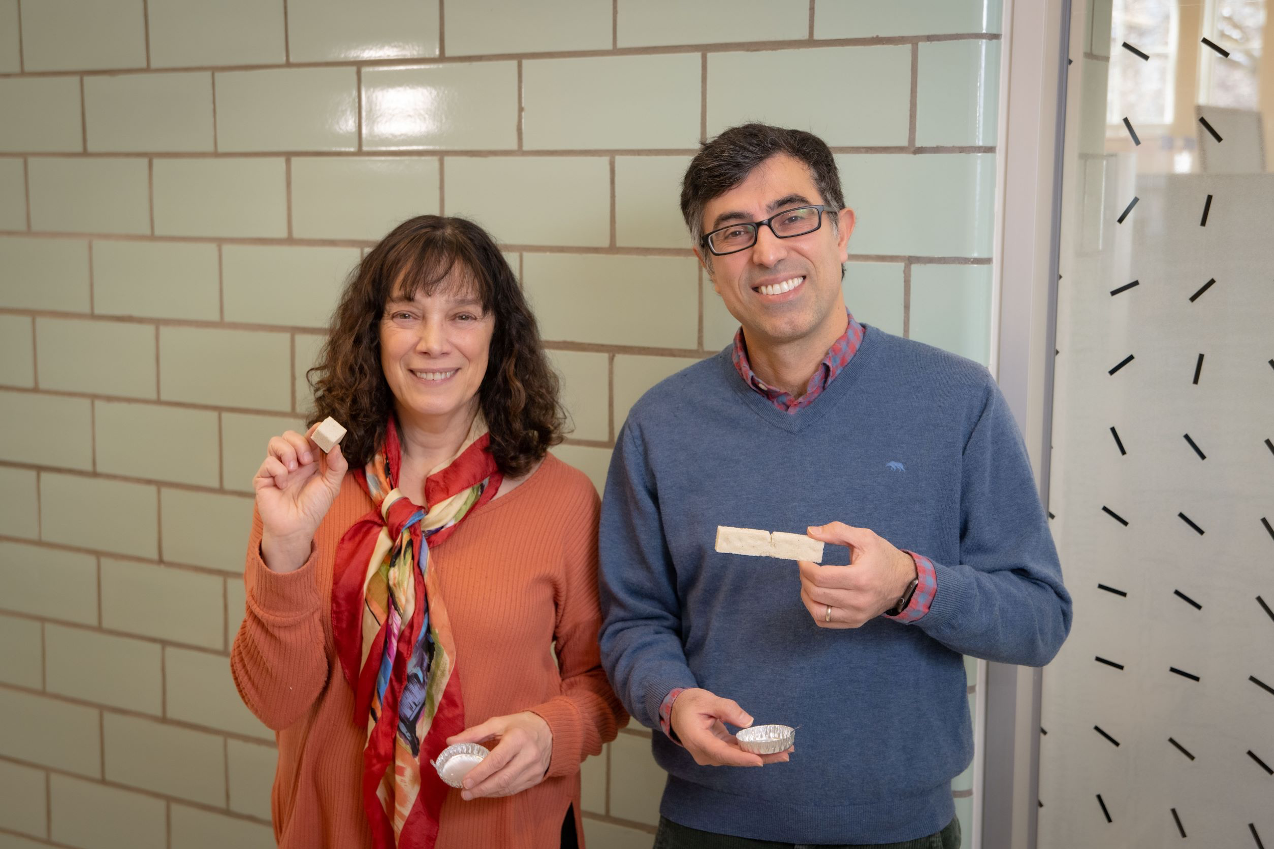 Professors Suzanne Scarlata and Nima Rahbar hold samples of enzymatic construction material. Source: Worcester Polytechnic Institute