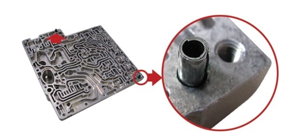 Figure 4: Light duty coiled spring pins in an aluminum automotive valve body assembly. Source: Spirol