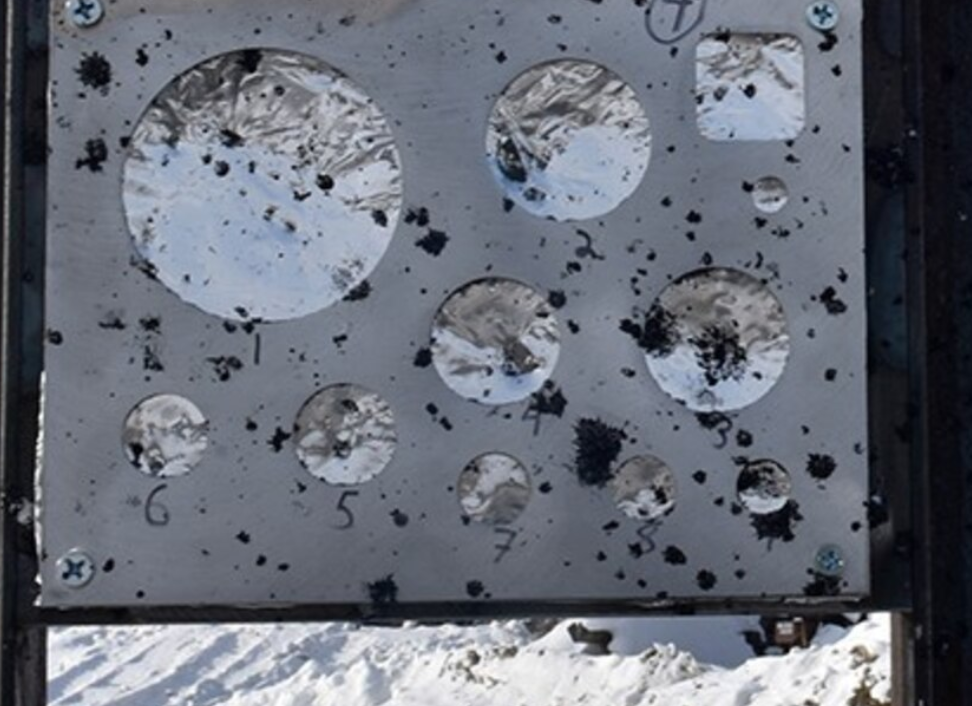 A gauge stand measures the effect of an explosion during the snow mitigation test at Eielson Air Force Base, Alaska. The foil pieces are used to measure the blast caused by the explosion. Source: U.S. Air Force photo/Senior Airman Danielle Sukhlall