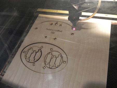 Figure 1: A laser cutter cutting shapes from wood. Source: 0xF2 / CC BY-ND 2.0