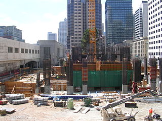 Crane footing, concrete core and construction equipment in August 2006.