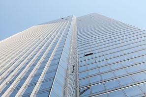 The complex includes a 58-story high-rise tower and a 12-story mid-rise. 