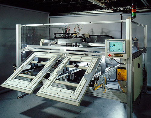Figure 1: Visumatic dual X-Y robotic assembly system. Source: Visumatic