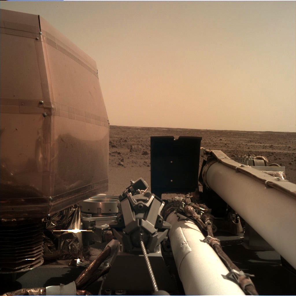 A picture of InSight’s landing site on Mars, taken by the lander’s Instrument Deployment Camera (IDC) on November 26. Source: NASA