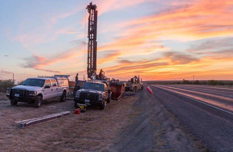 A coring and geophysical well-logging operation rises beside U.S. Route 90 in Kinney County, Texas. Source: Stanley T. Paxton, U.S. Geological Survey