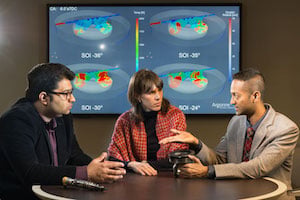 Argonne Mechanical Engineer Sibendu Som discusses piston bowl design with VERIFI team members Assistant Computational Scientist Marta Garc&iacute;a and Mechanical Engineer Janardhan Kodavasal. Image credit: ANL.
