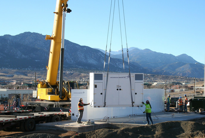 Workers install portions of a battery storage system at Fort Carson, Colo. Credit: Scott Clark, USACE