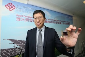 PolyU Professor Charles Chee Surya holds a perovskite solar cell. Image credit: Hong Kong Polytechnic University.