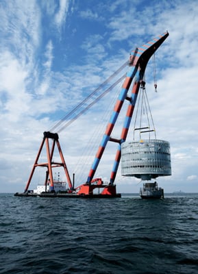 Energy substation with 120 MVA transformer being installed in waters off of Sweden in 2008. Image source: NREL, credit Siemens AG.