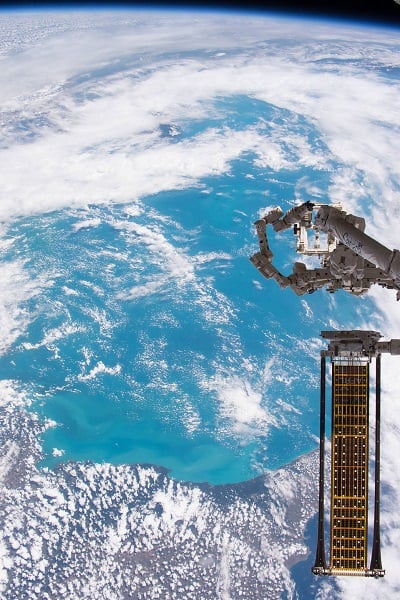 The Roll-out Solar Array was deployed from the end of the Canadarm2 robotic arm outside the International Space Station. (Source: NASA Johnson)