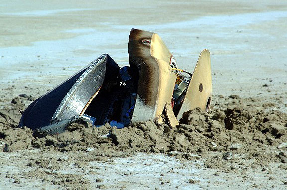 The Genesis probe was designed to be snagged out of the air by a helicopter after being slowed by a drogue parachute and parafoil. Instead, parachute deployment failed and the probe smashed into the ground. Source: NASA