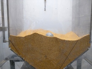 The flow aid is placed inside a bin and controlled with Bluetooth. Source: Purdue University