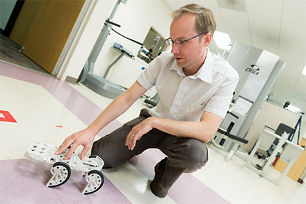 iStride developer, Kyle Reed, demonstrates a prototype of the device. Source: University of Southern Florida  