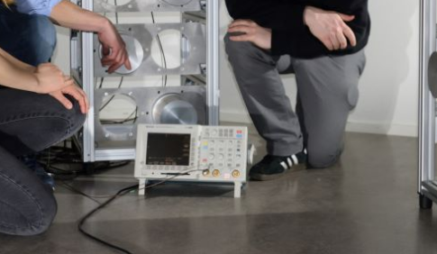 Researchers test the new imaging technology on a mock-up of radioactive waste drum scanner. Source: Biswarup Das